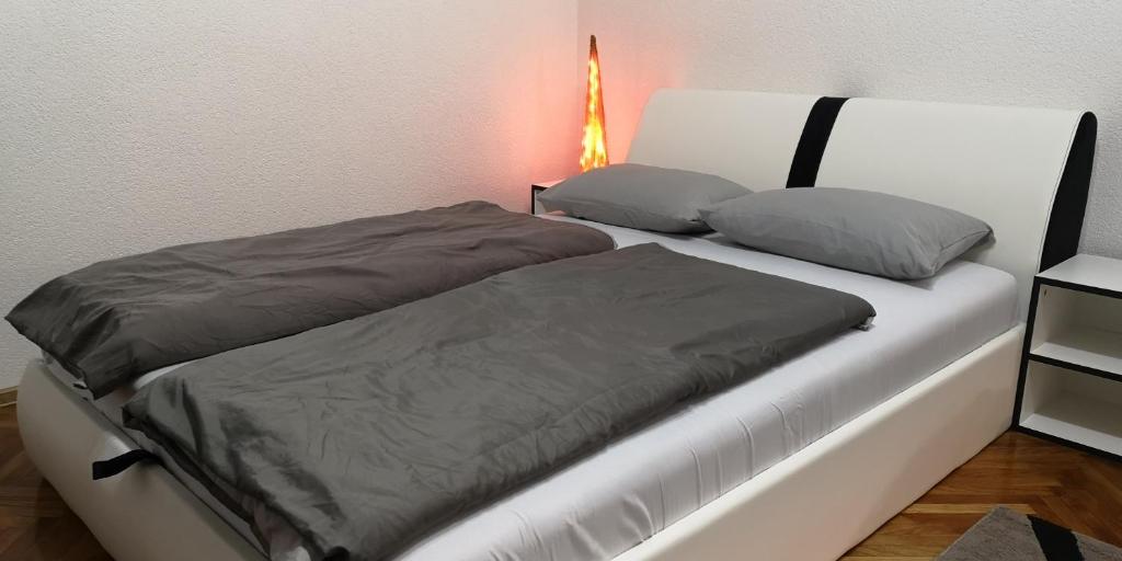 Postel nebo postele na pokoji v ubytování Apartment Cakic