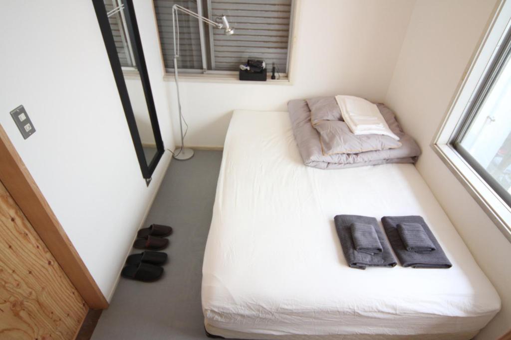 Postel nebo postele na pokoji v ubytování guesthouse SHIBAFU