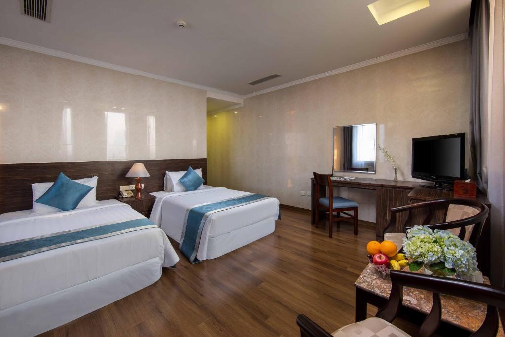 Postel nebo postele na pokoji v ubytování Danly Hotel