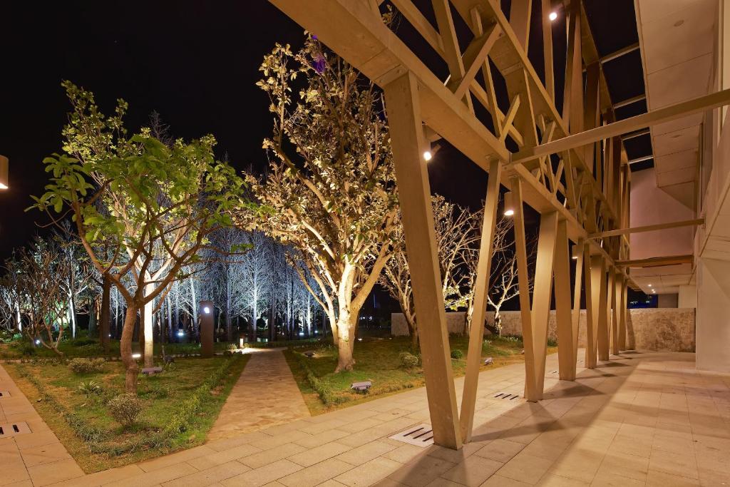 a row of trees in a park at night at Volando Kenting in Hengchun