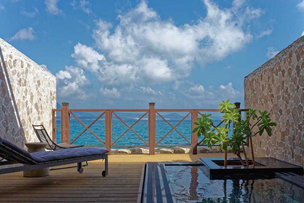 a patio with a view of the ocean at Volando Kenting in Hengchun