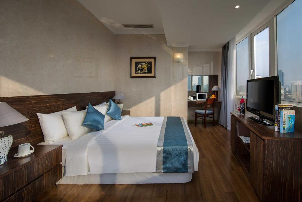 Postel nebo postele na pokoji v ubytování Danly Hotel