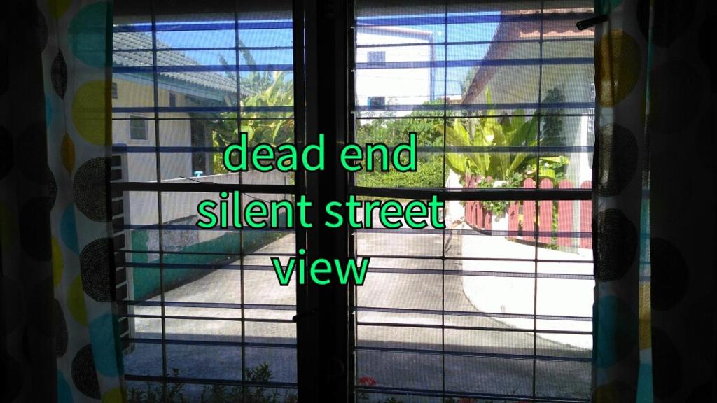 a window with the words dead end silent street view at Studio with Aircon in Bang Tao Beach