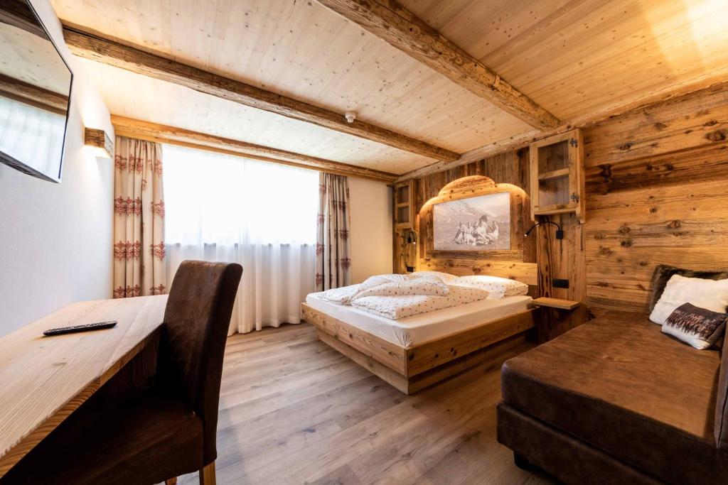 Postel nebo postele na pokoji v ubytování Garni Hotel Residence Diamant