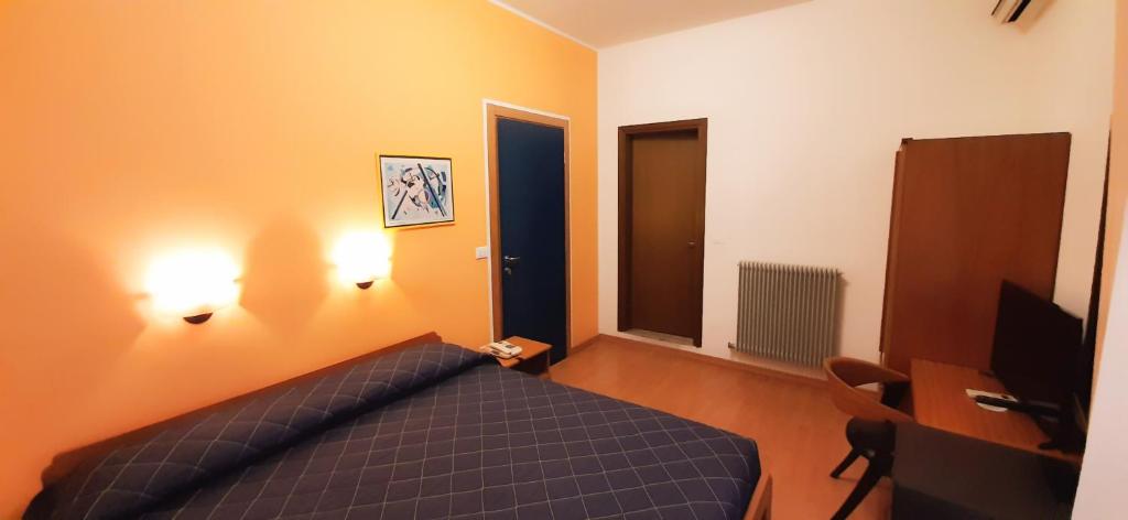 Postel nebo postele na pokoji v ubytování Hotel Principe