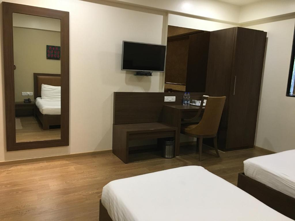 Postel nebo postele na pokoji v ubytování Hotel Amigo