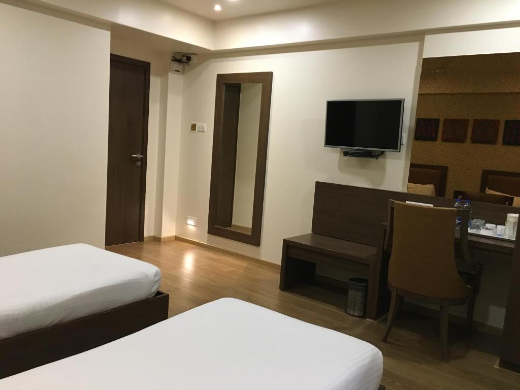 TV a/nebo společenská místnost v ubytování Hotel Amigo