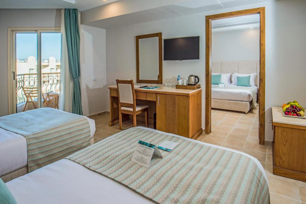 Postel nebo postele na pokoji v ubytování Sunrise Aqua Joy Resort