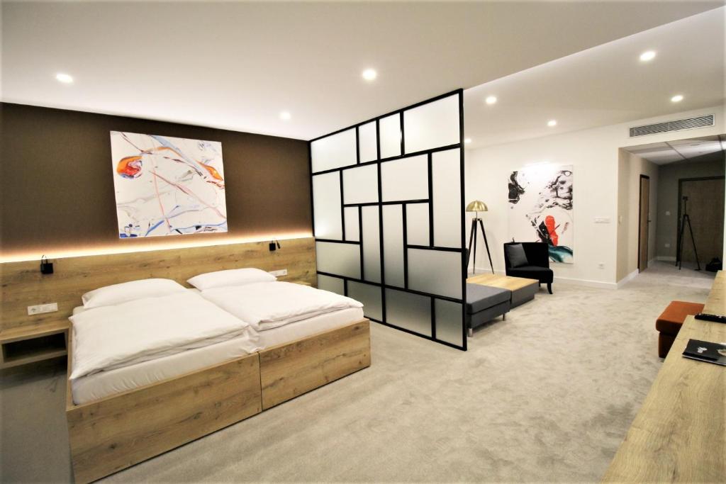 Postel nebo postele na pokoji v ubytování Hotel Magnus Trenčín