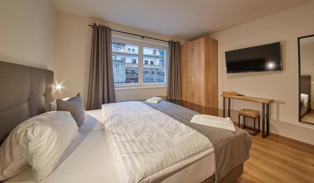 Postel nebo postele na pokoji v ubytování Appartements Der Fuchsbau