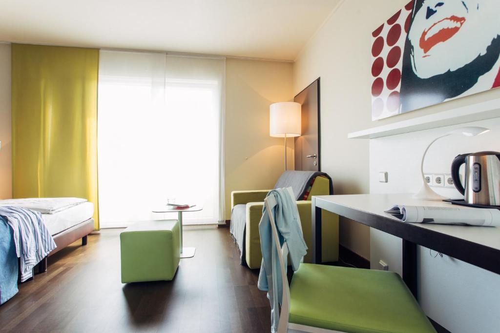 Voodi või voodid majutusasutuse harry's home Linz-Urfahr hotel & apartments toas