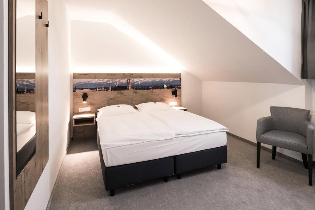 Postel nebo postele na pokoji v ubytování Hotel Fischerwirt