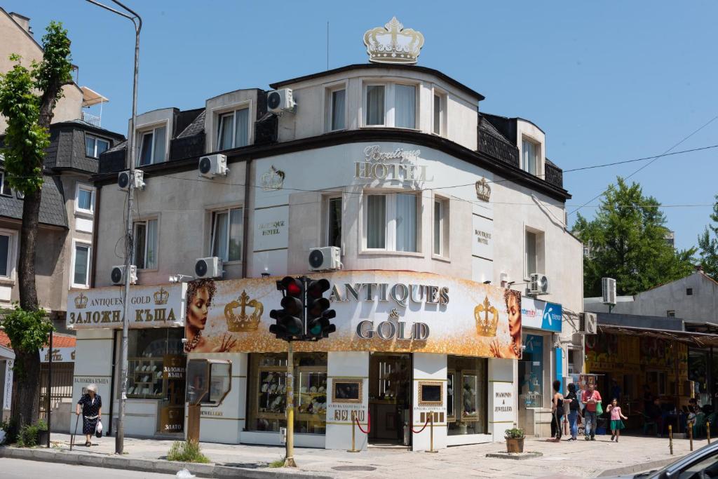 a building on a street corner with a traffic light at ANTIQUES & GOLD Boutique Guesthouse in Varna City