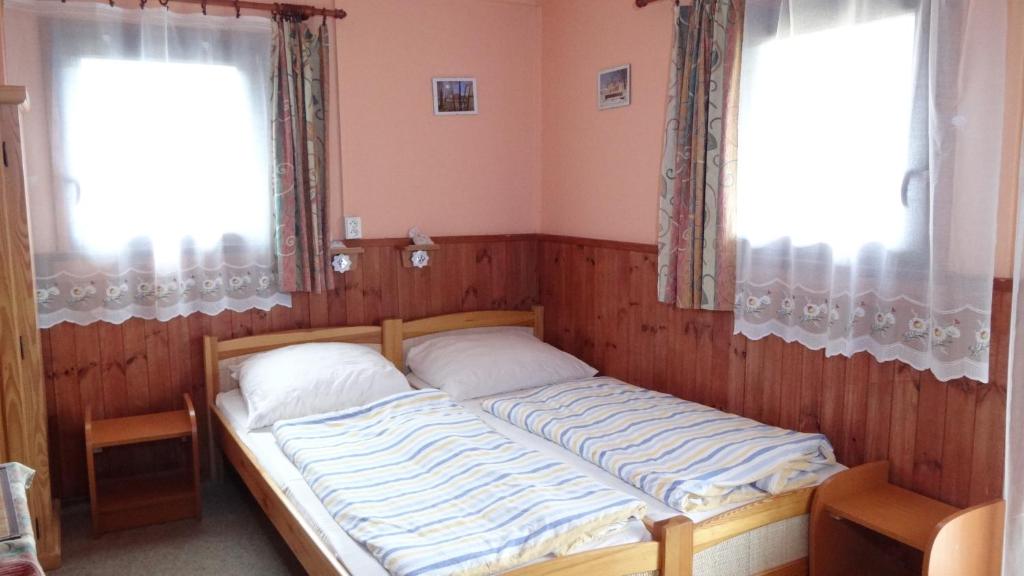 Postel nebo postele na pokoji v ubytování osada yukon