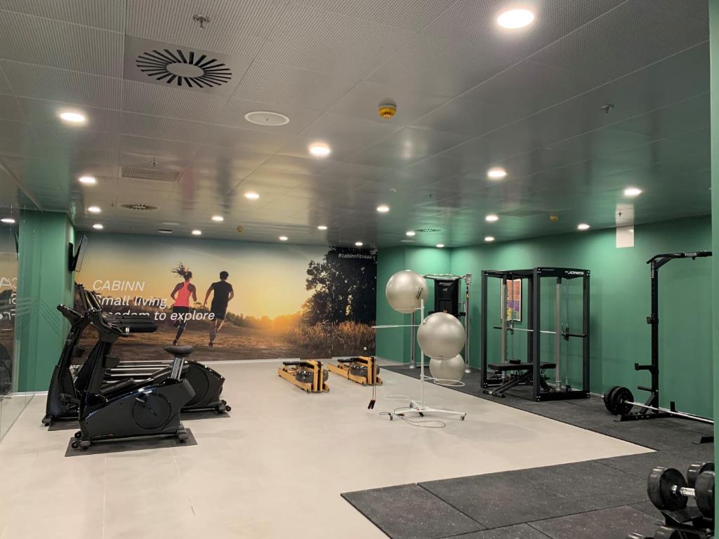 a gym with a large poster on the wall at Cabinn Copenhagen in Copenhagen