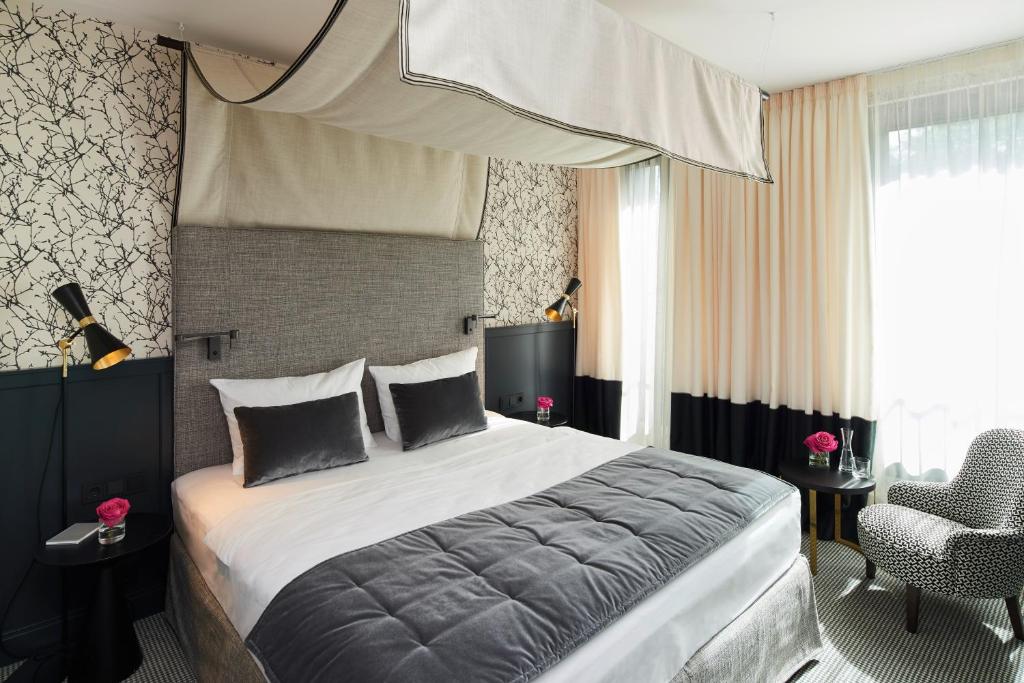 Postel nebo postele na pokoji v ubytování Hotel am Ochsentor