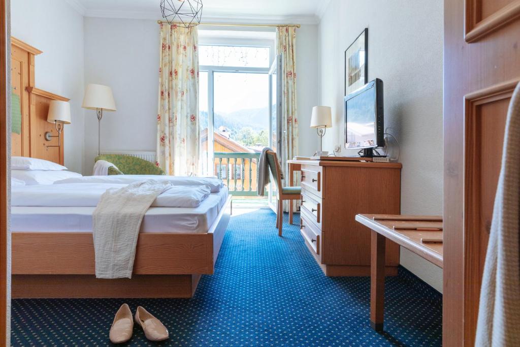 Postel nebo postele na pokoji v ubytování Hotel Sonnenspitze