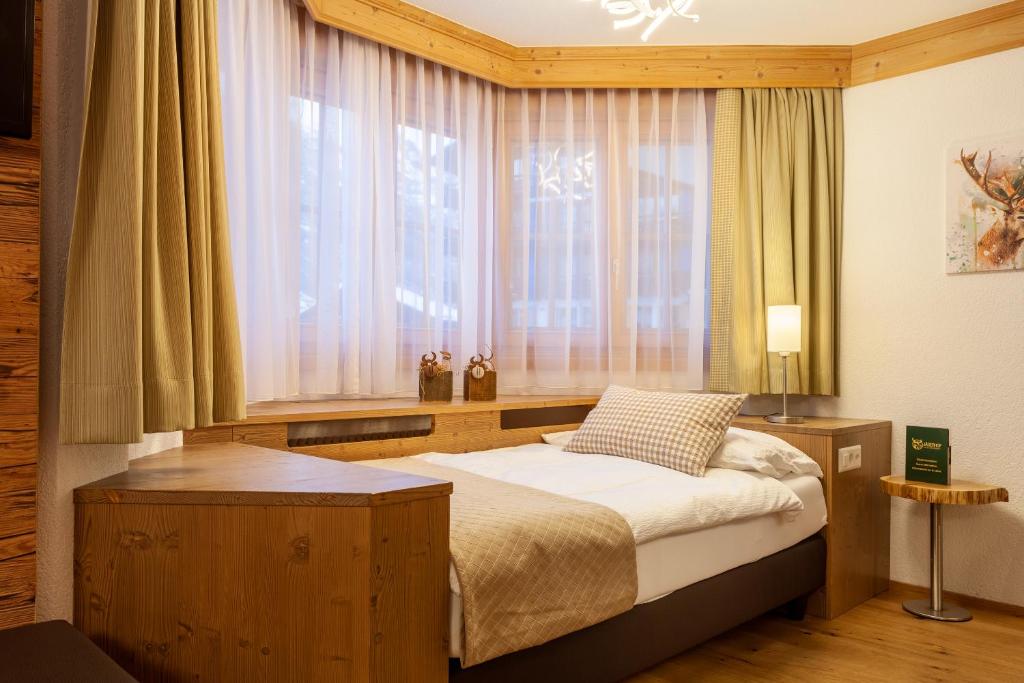 Ein Bett oder Betten in einem Zimmer der Unterkunft Hotel Jägerhof