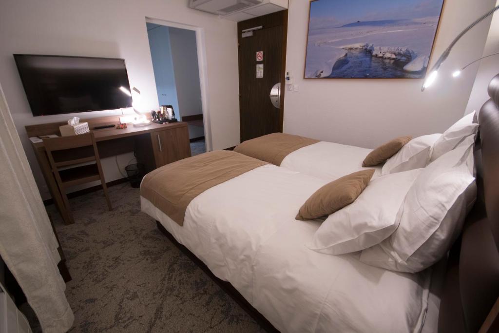 Posteľ alebo postele v izbe v ubytovaní Hôtel Bastide
