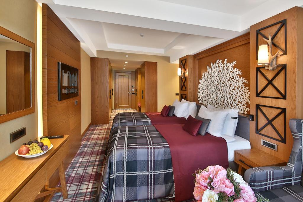 Кровать или кровати в номере Bof Hotels Uludağ Ski&Luxury Resort All Inclusive