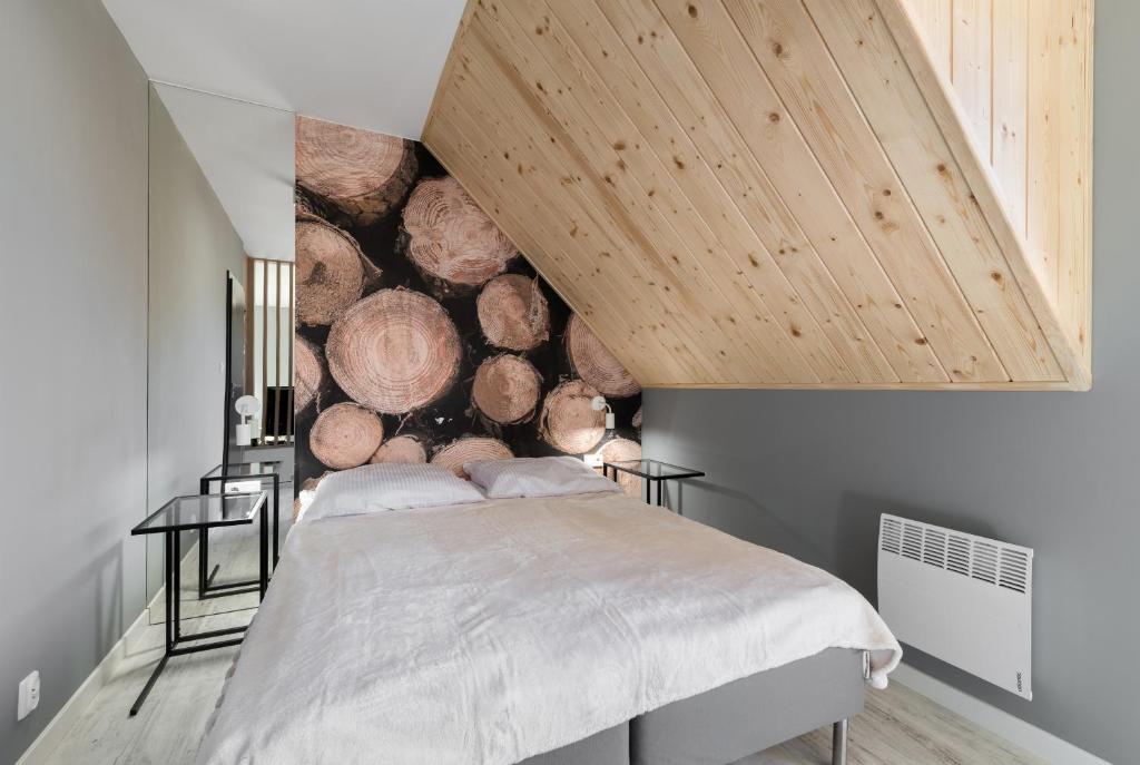 Posteľ alebo postele v izbe v ubytovaní Apartament Widok