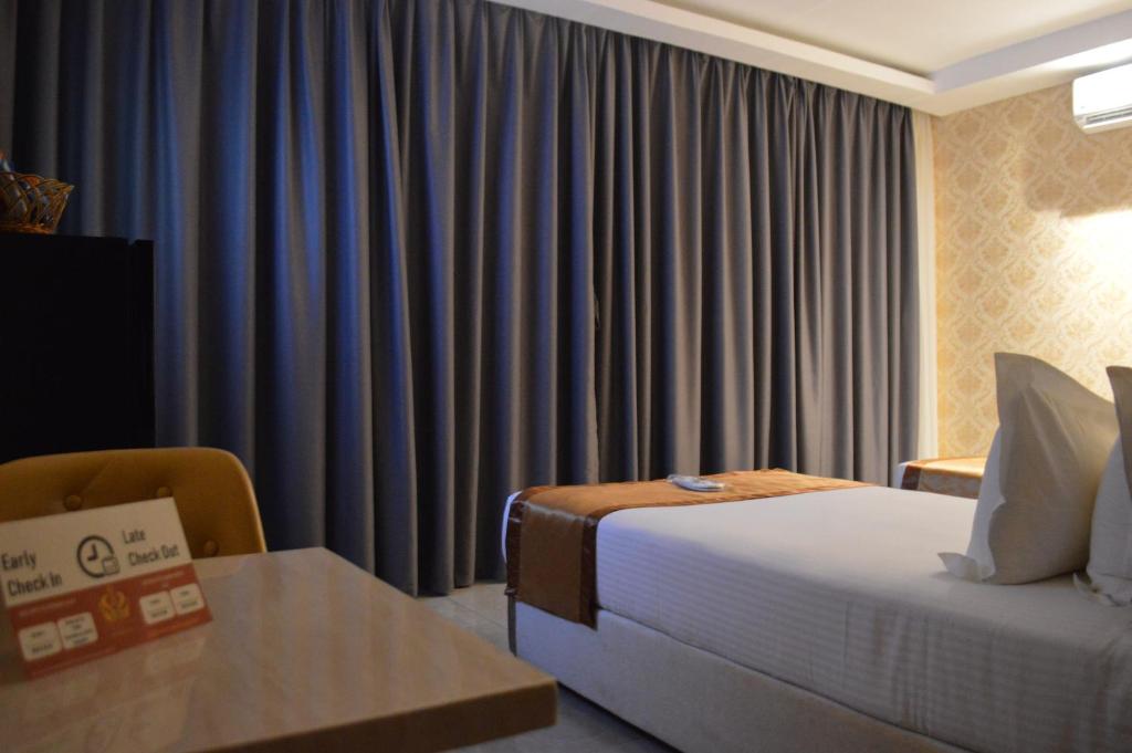Voodi või voodid majutusasutuse Hotel Crowner David toas