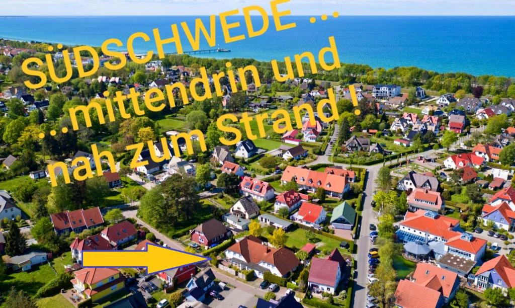 vue aride d'une banlieue avec un panneau jaune qui lit l'esprit subsidizedolithicolithique dans l'établissement DER SÜDSCHWEDE ... Dein Gästehaus mitten in Zingst und nah zum Strand, à Zingst