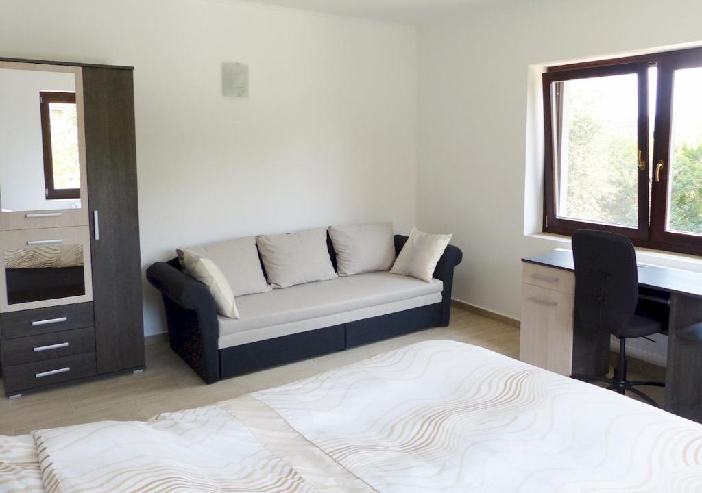 Postel nebo postele na pokoji v ubytování Guest House Magyarlukafa