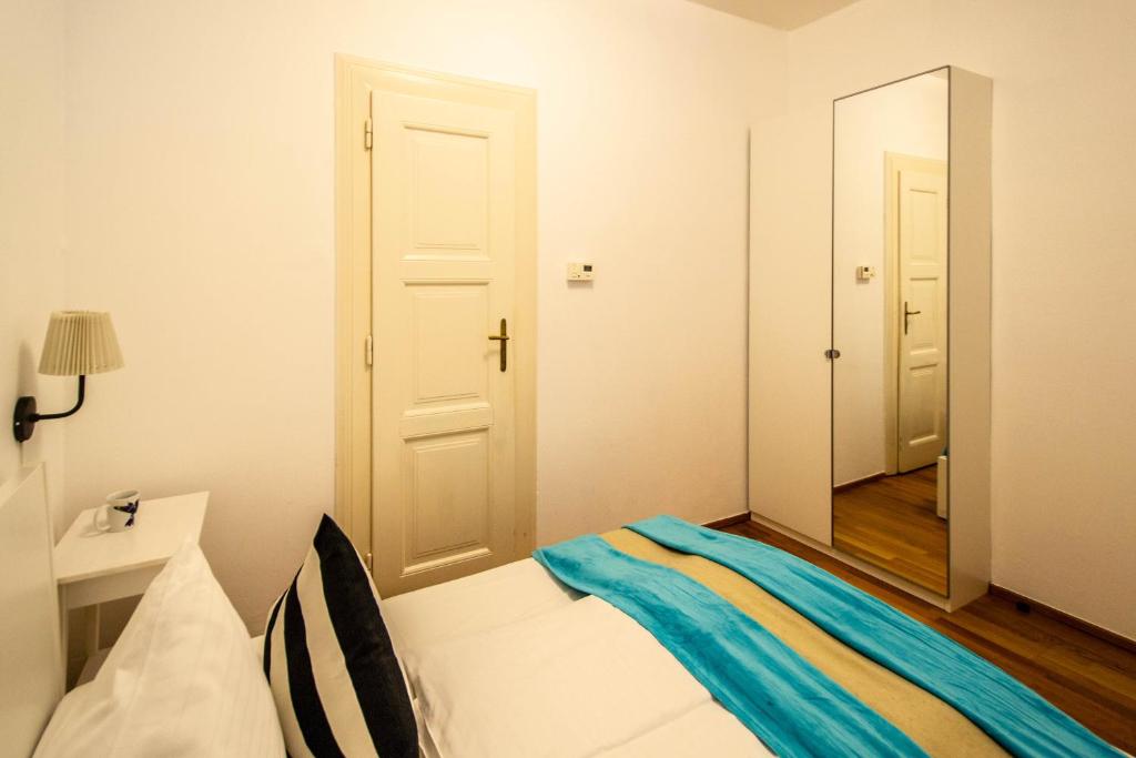 Postel nebo postele na pokoji v ubytování Labyrinth apartments by Ruterra