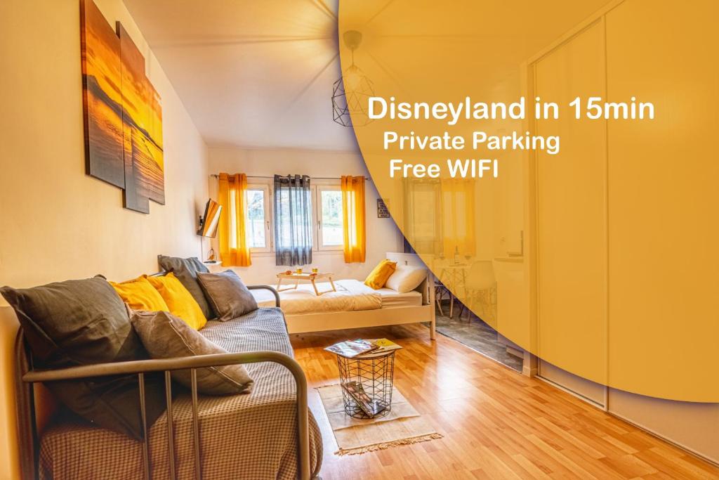a living room with a couch and a yellow wall at Sweet New Apartment Close to Disneyland Paris in Thorigny-sur-Marne