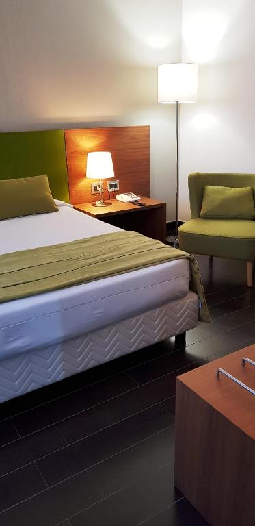 Postel nebo postele na pokoji v ubytování Hotel Sandalia