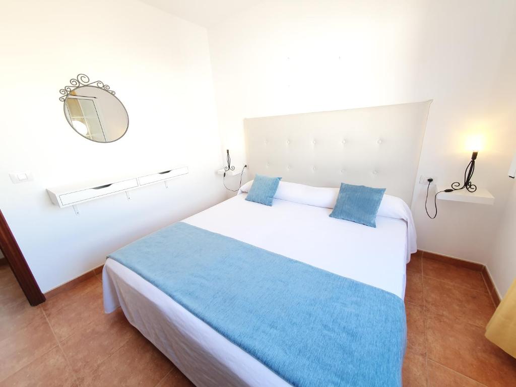 Postel nebo postele na pokoji v ubytování Apartamentos Graciosamar