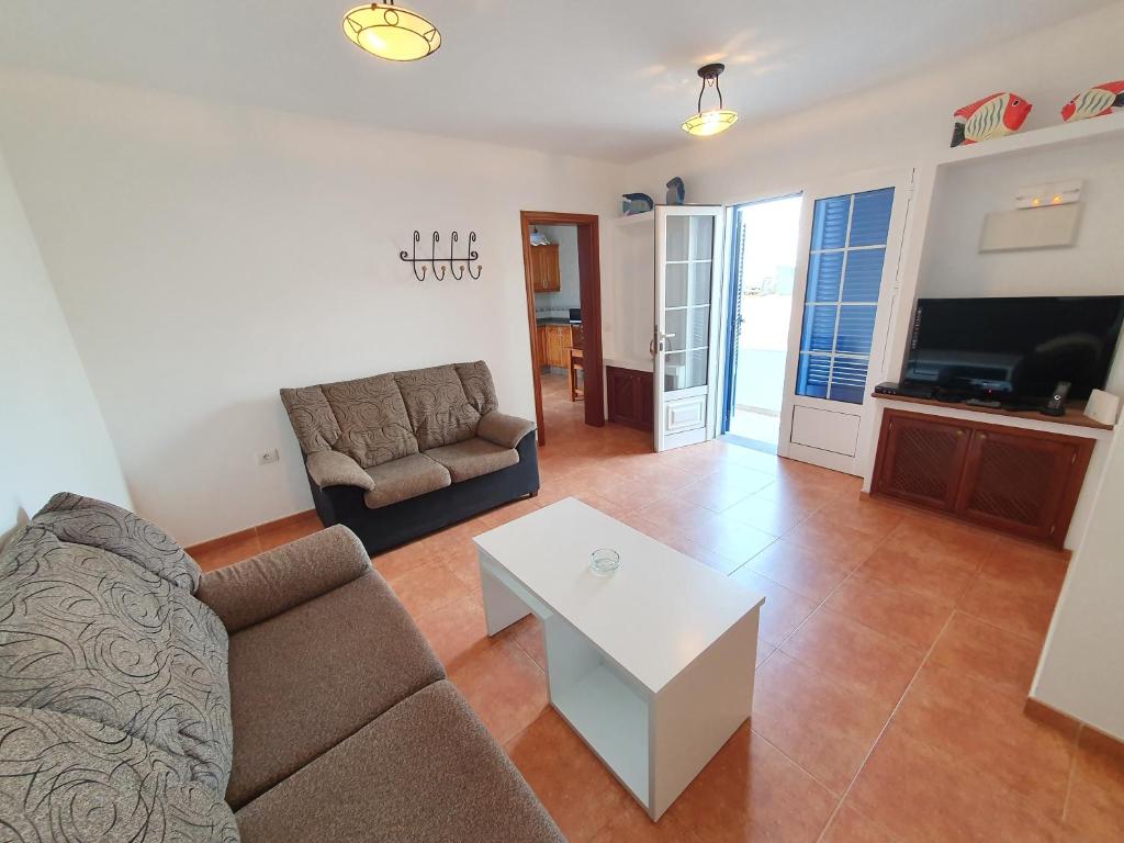 TV a/nebo společenská místnost v ubytování Apartamentos Graciosamar