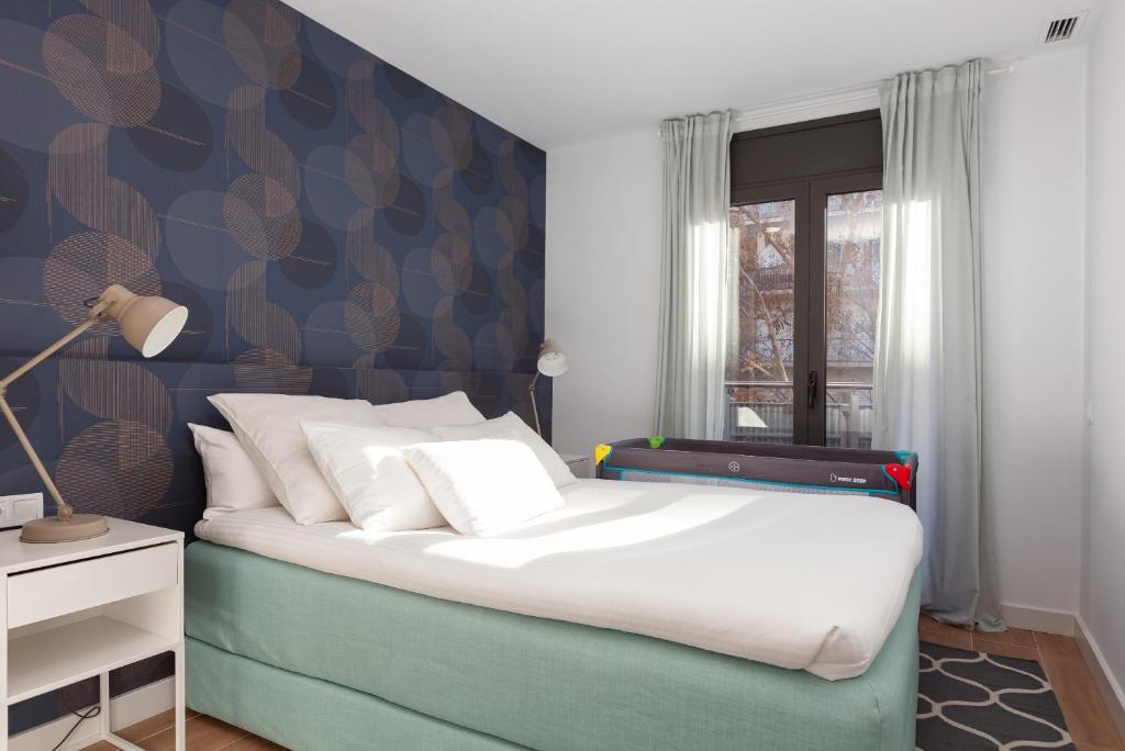 Postel nebo postele na pokoji v ubytování Mediterranean Barcelona Apartments