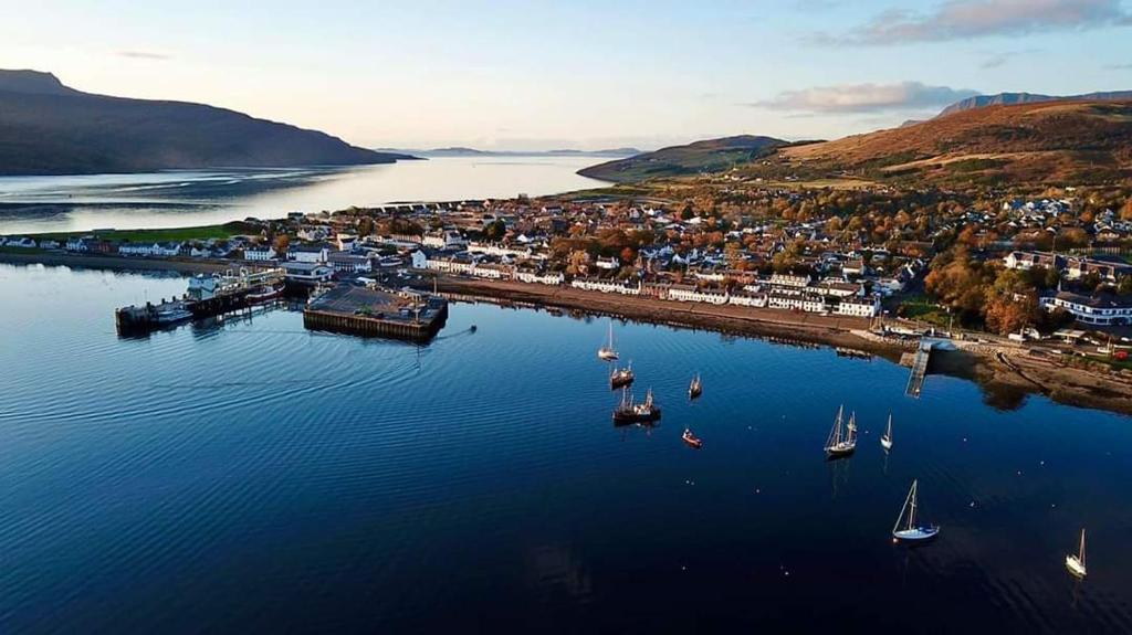 an aerial view of a harbor with boats in the water at Number 27 in Ullapool