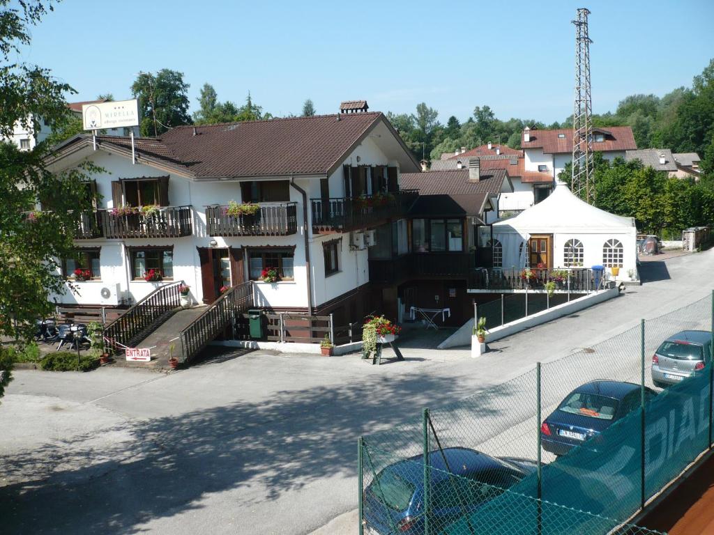 a building on the side of a street at Albergo Mirella in Belluno