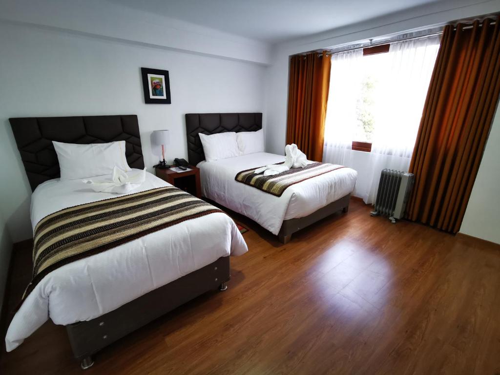 Postel nebo postele na pokoji v ubytování Hotel Andes de Urubamba