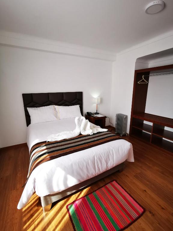 Postel nebo postele na pokoji v ubytování Hotel Andes de Urubamba