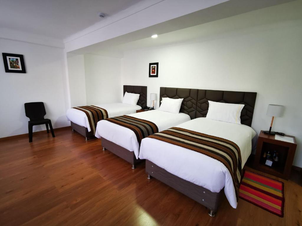 Postel nebo postele na pokoji v ubytování Hotel Andes de Urubamba