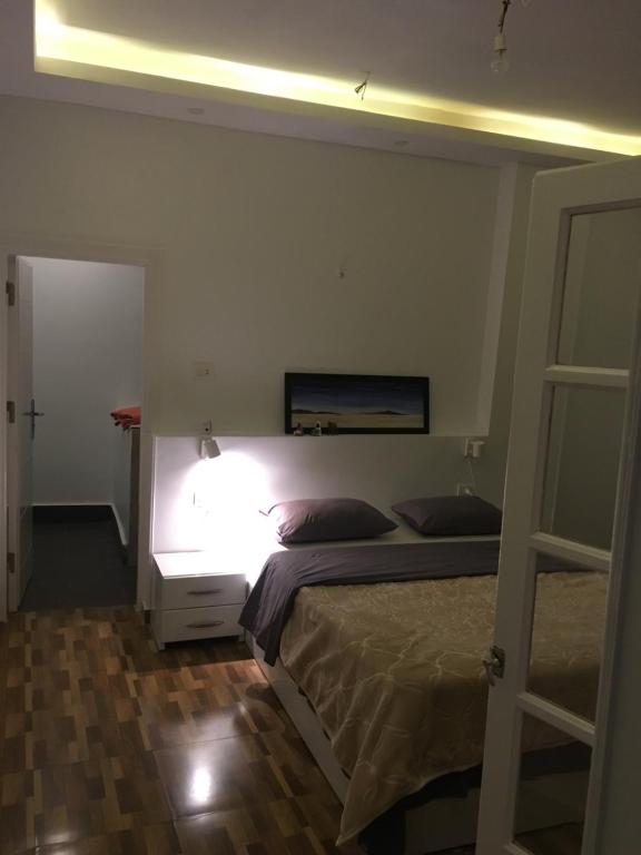 Postel nebo postele na pokoji v ubytování The Mango Guest House