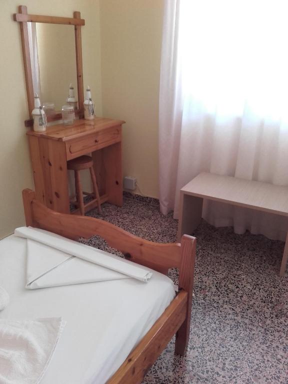 Postel nebo postele na pokoji v ubytování Rooms Apostolis