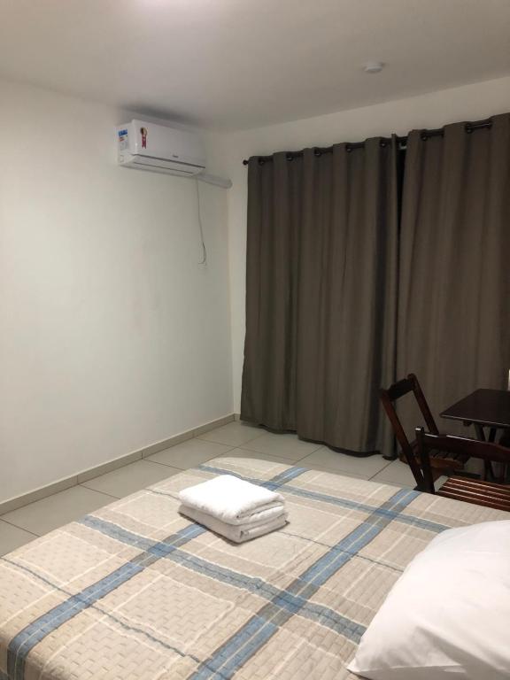 Postel nebo postele na pokoji v ubytování Kitnet 1 mobiliada no centro de Torres a 600m da Praia Grande