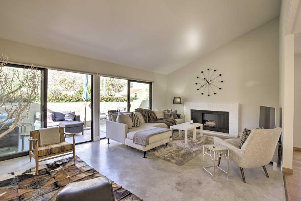 a living room with a couch and a fireplace at Condo with Mountain Views-3mi to DT Palm Springs in Palm Springs