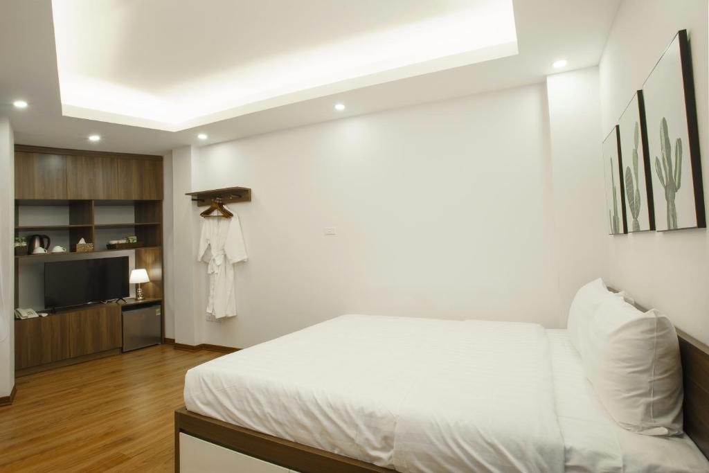 Postel nebo postele na pokoji v ubytování Hanoi Veris Boutique Hotel & Spa