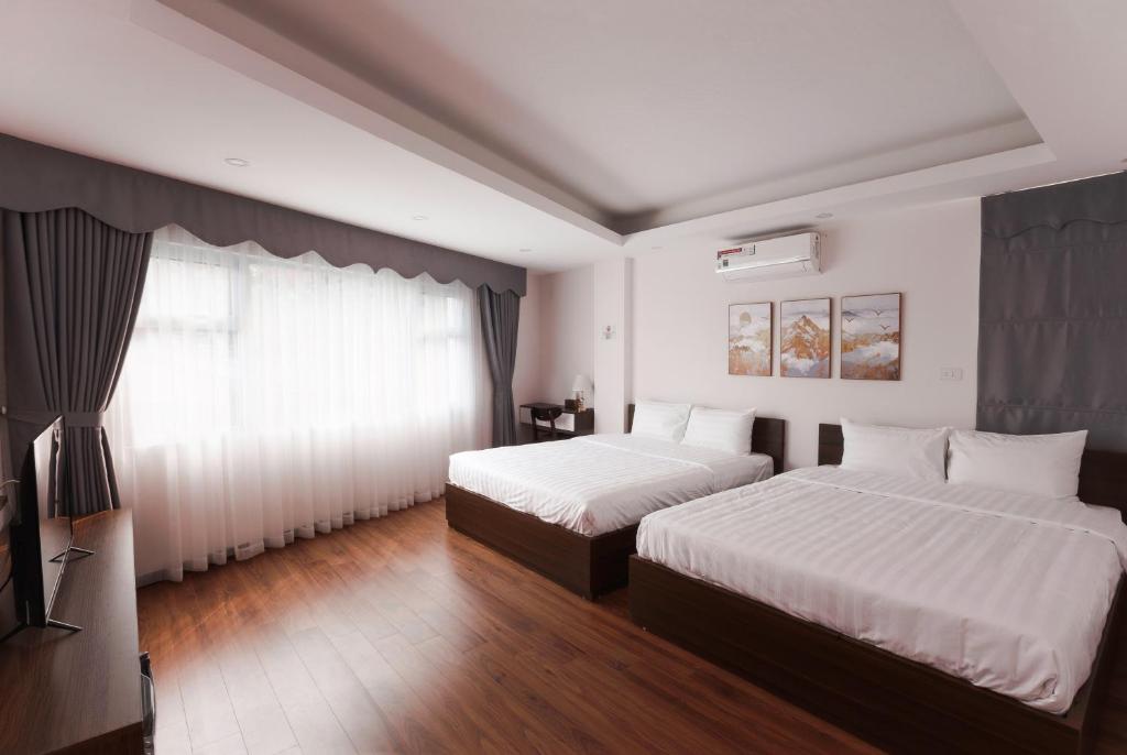 Postel nebo postele na pokoji v ubytování Hanoi Veris Boutique Hotel & Spa
