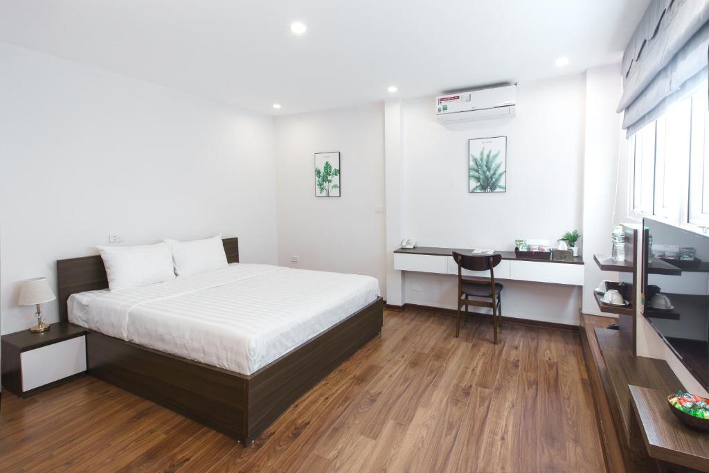 Postel nebo postele na pokoji v ubytování Hanoi Veris Boutique Hotel & Spa