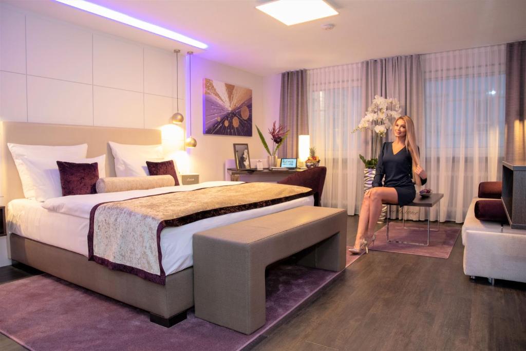 Postel nebo postele na pokoji v ubytování Hotel Merkur - Superior
