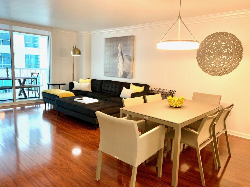 a living room with a table and a couch at Top Stay Miami Gold Brickell in Miami