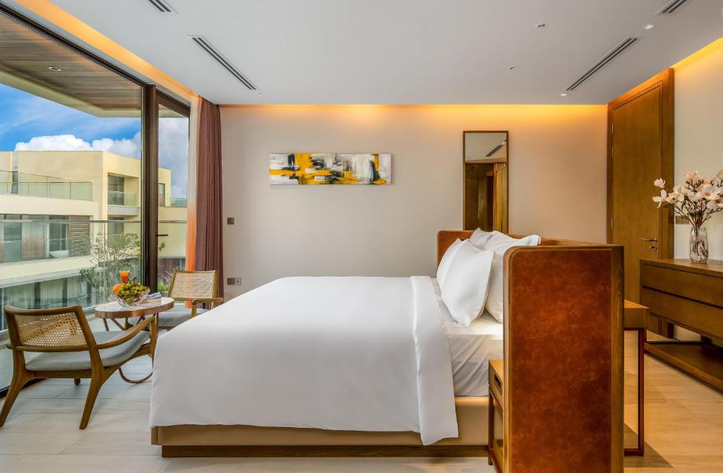 Postel nebo postele na pokoji v ubytování The Five Villas & Resort Quangnam - Danang