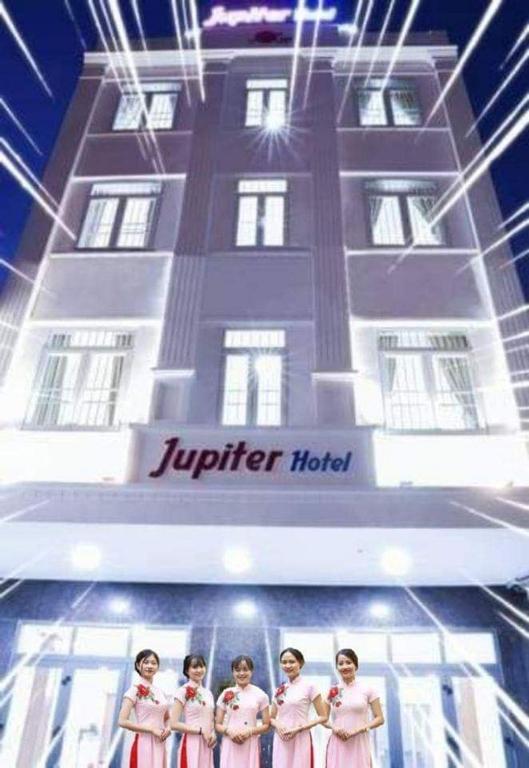 a group of women standing in front of a hotel at Jupiter Hotel in Vung Tau